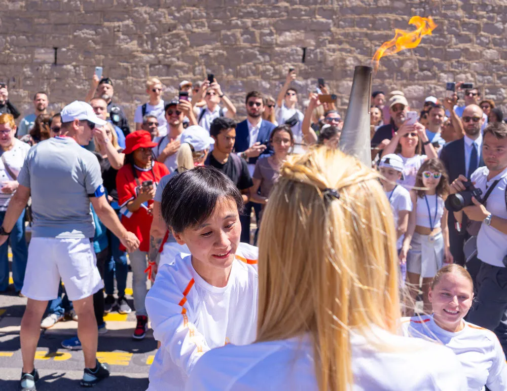 Born in Beijing, she is the first Chinese face in the Paris Olympics torch relay.