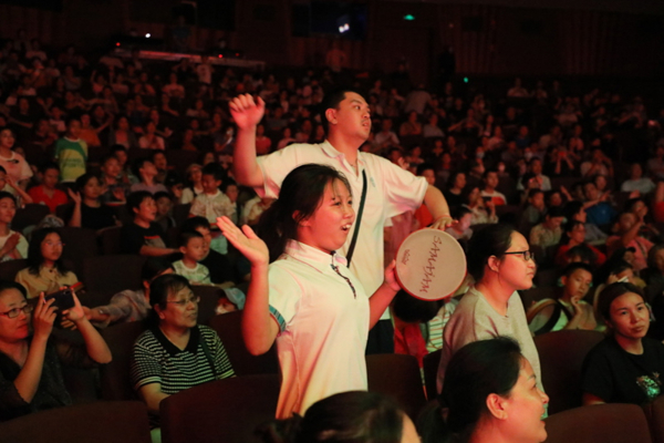 It turned out that this group of special children were responding, and a drumbeat could be heard from the audience