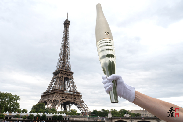 The Paris Olympic Torch made its public debut on the Seine River, inspired by water. | Olympic Games | Paris Olympic Torch